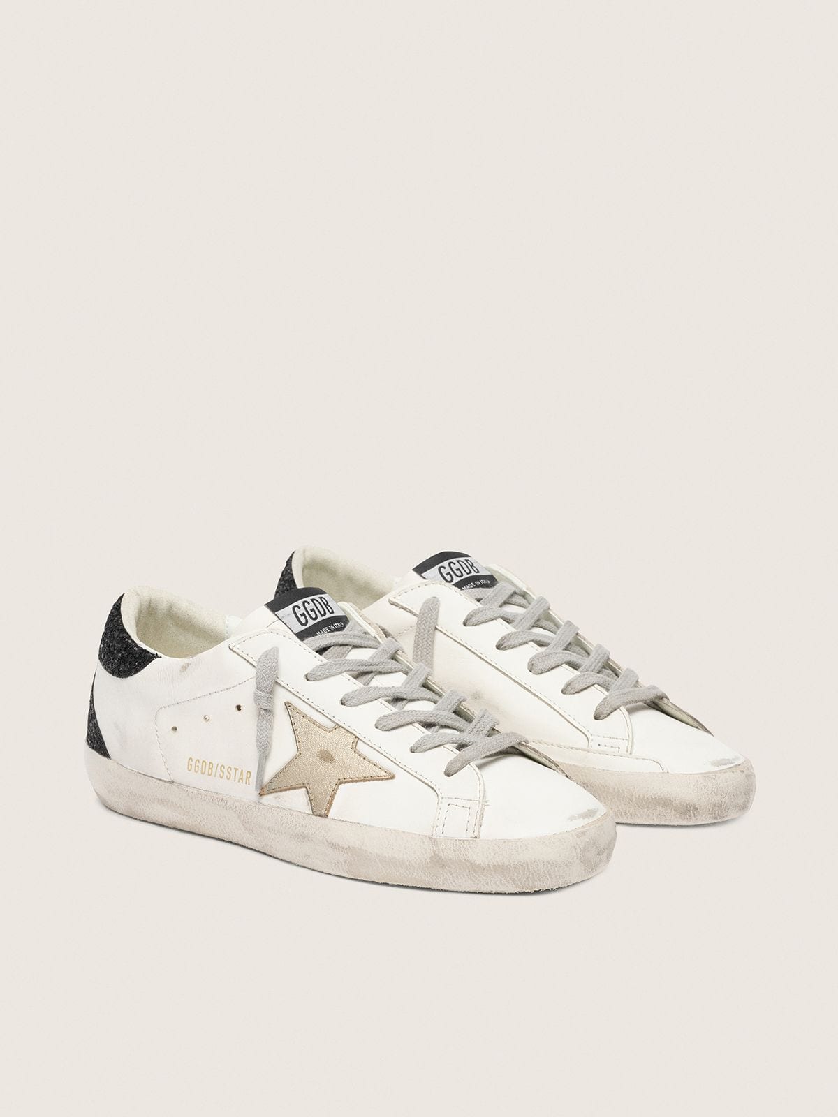 Super-Star avec étoile dorée et contrefort à paillettes noires