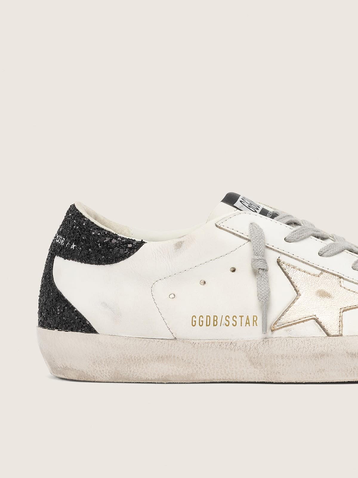 Super-Star avec étoile dorée et contrefort à paillettes noires