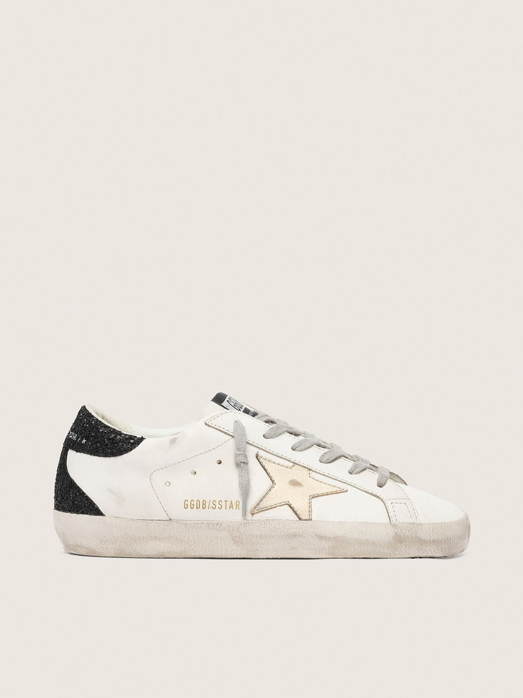 Super-Star avec étoile dorée et contrefort à paillettes noires
