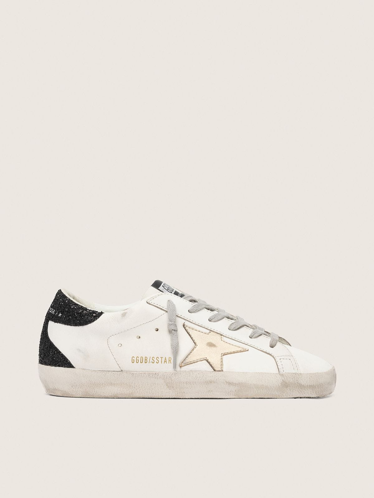 Super-Star avec étoile dorée et contrefort à paillettes noires